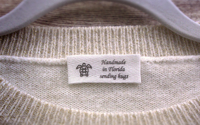 attaching designer labels on clothes